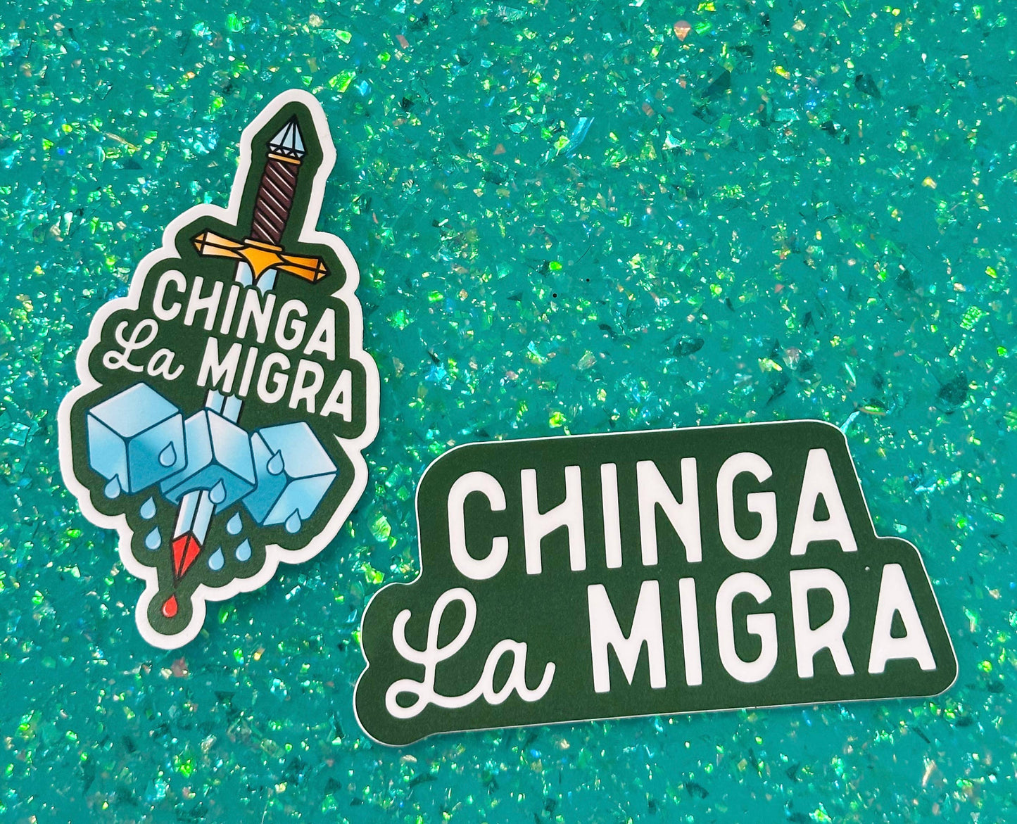 Sticker with 'Chinga La Migra' design on a textured teal background