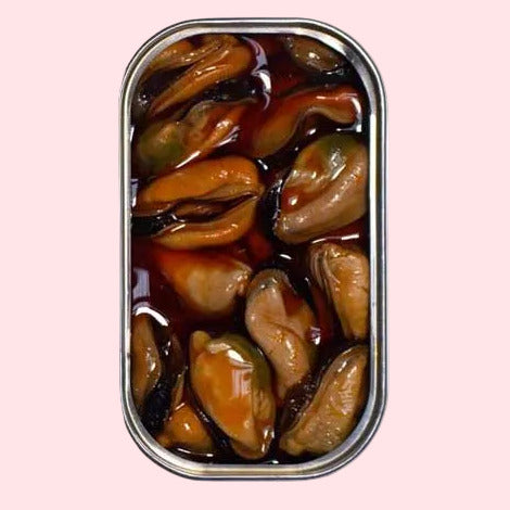 Spiced mussels in pickled sauce packaging with blue label and tin of mussels.