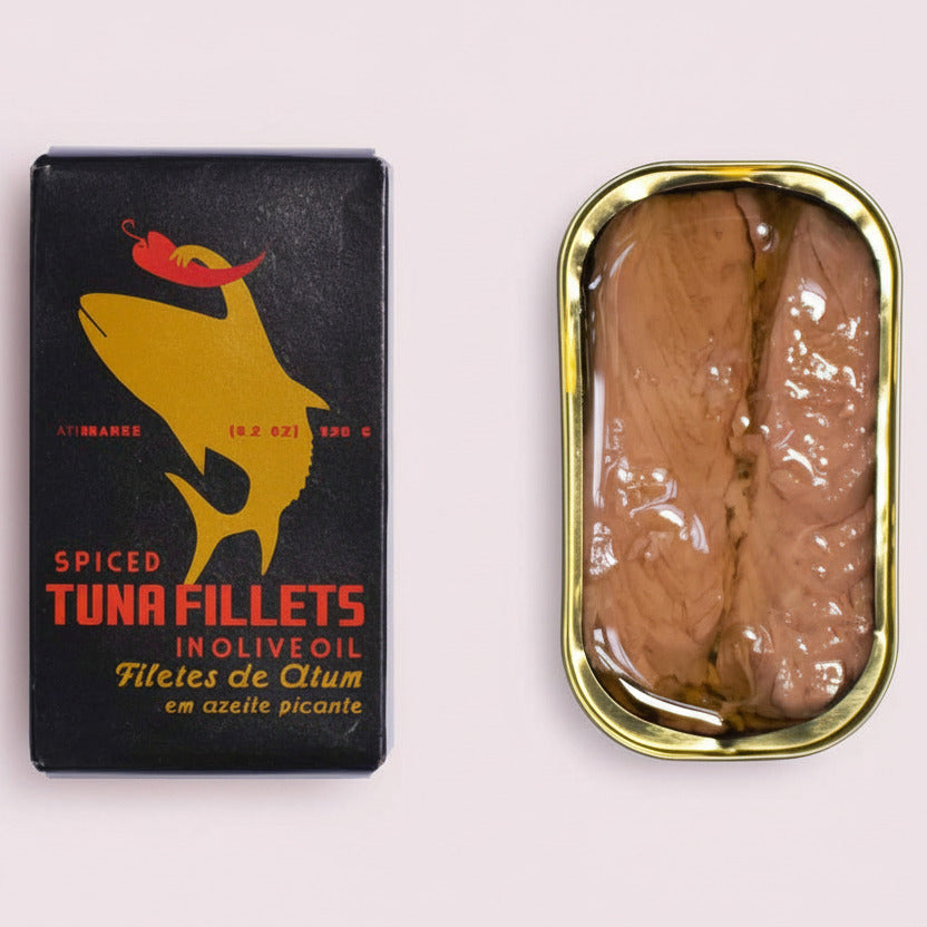 Ati Manel Spiced tuna fillets in olive oil with packaging on a white background