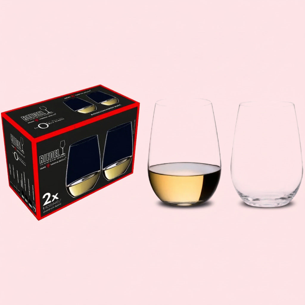Two wine glasses with one containing white wine, next to their packaging box on a white background.