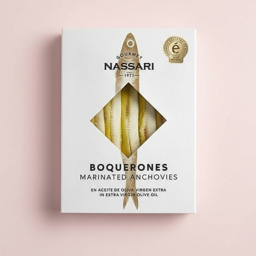 Nassari Boquerones marinated anchovies packaging on a light pink surface