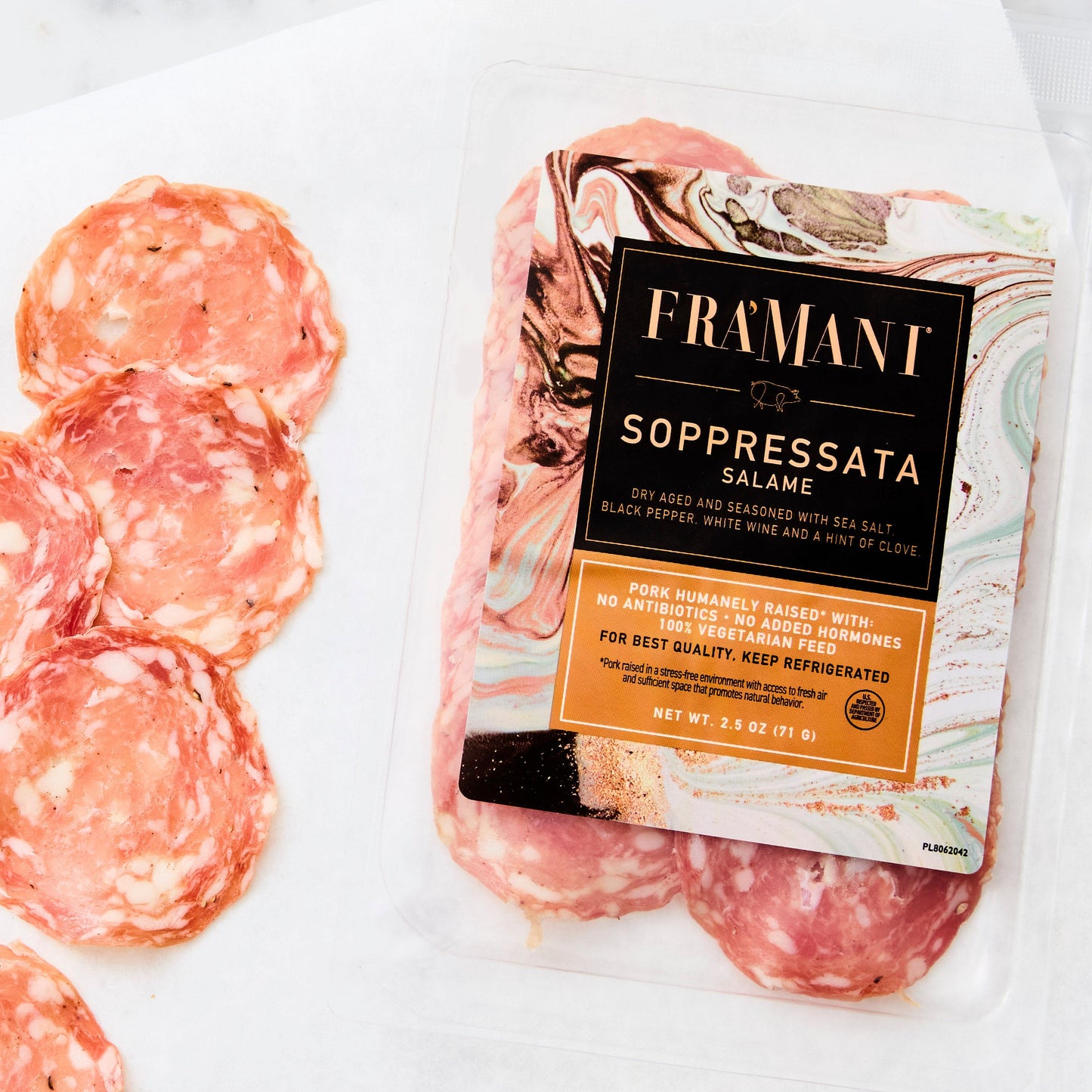 Packaged salami with a visible brand label on a white surface